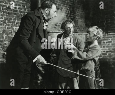 FILM Oliver Twist (1948, David Lean) Kenneth Downey (Arbeitshaus Master), unbekannte, John Howard Davies (Oliver Twist) Stockfoto