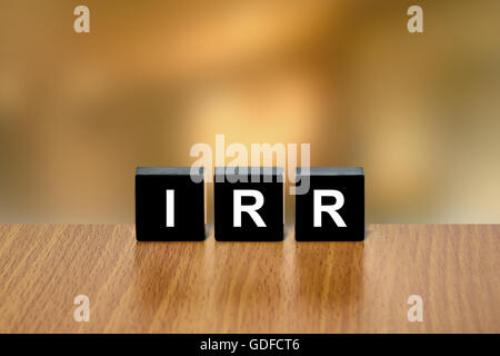 IRR or Internal Rate Of Return on black block with blurred background Stockfoto