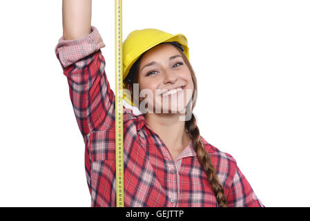 Nahaufnahme der schönen Frau Bauarbeiter Maßnahmen mit einem Messgerät Klebeband isoliert weißen Hintergrund. Stockfoto