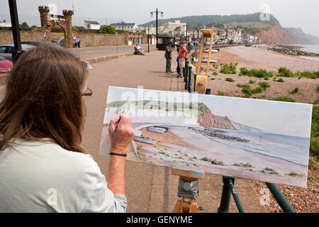 Großbritannien, England, Devon, Sidmouth, Künstler Malerei der Esplanade im Sonnenschein Stockfoto