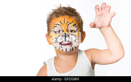 schöne junge Kind mit Kinderschminken ein Tiger oder ein Löwe Stockfoto