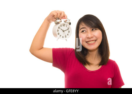Schwangere Frau mit Wanduhr. Es ist Zeit. Isoliert auf weiss. Stockfoto