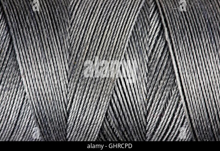 Textur des grauen Fäden auf der Spule, Nahaufnahme Stockfoto