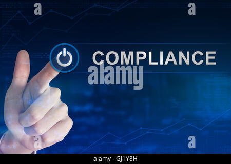 Doppelbelichtung Business hand klicken Compliance-Knopf mit unscharfen Hintergrund Stockfoto