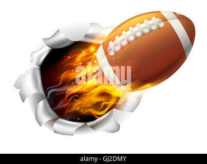 Ein Beispiel für einen brennenden flammenden American Football Ball auf Feuer reißen ein Loch in den Hintergrund Stockfoto