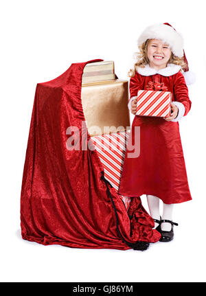 Kleines Mädchen in rotem Samt Urlaub Kleid feiert Weihnachten, isoliert auf weiss. Stockfoto