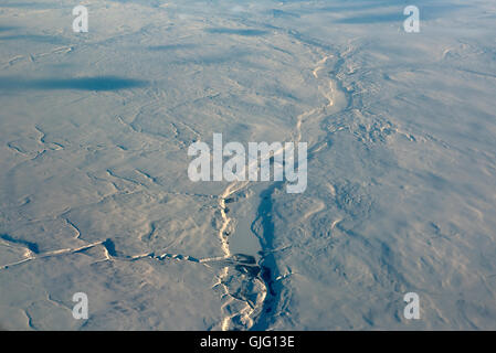 Die verschneiten Abfälle und Trostlosigkeit des North West Kanada von 34.000' von Flug auf dem Weg nach Vancouver.  SCO 11.155 Stockfoto