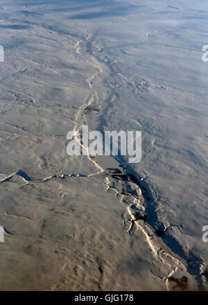 Die verschneiten Abfälle und Trostlosigkeit des North West Kanada von 34.000' von Flug auf dem Weg nach Vancouver.  SCO 11.159. Stockfoto