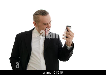 wütend Geschäftsmann in einer Jacke, die schreiend in Handy Mobilteil isoliert auf weißem Hintergrund Stockfoto