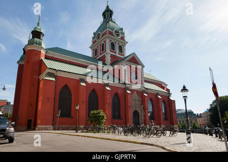 St. Jacobs Kyrka, St James' Church, eine rote Kirche mit einem grünen Kupferdach auf Jakobs Torg, Kungsträdgården in Stockholm Schweden. Stockfoto