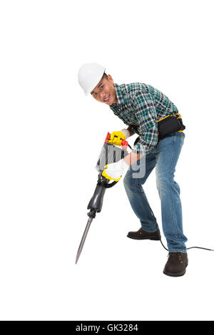 Junge Bauarbeiter nehmen der Bohrhammer Stockfoto