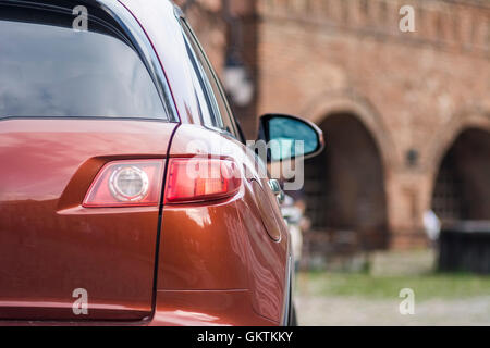 Fragment der orangene Auto. Kleine Schärfentiefe. Stock Foto. Stockfoto