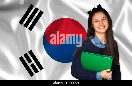 Teen Student lächelnd über koreanische Flagge. Konzept von Lehren und lernen von Fremdsprachen. Stockfoto