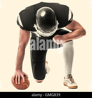 US-amerikanischer Footballspieler auf weißem Hintergrund. Getönten Foto. Stockfoto