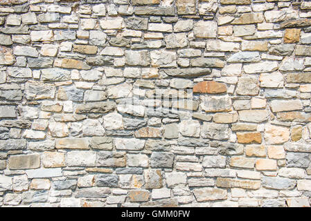 Nahaufnahme von einer alten Steinmauer. Stein Wand Hintergrund. Stockfoto