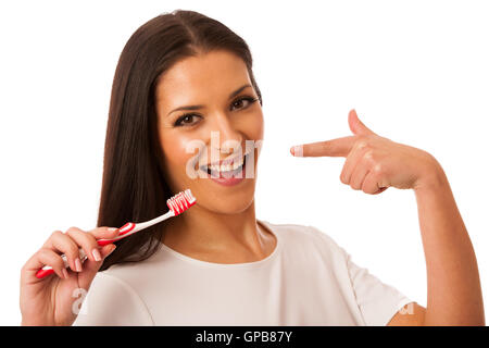 Frau, Reinigung mit Zahnbürste für perfekte Hygiene und gesunde Zähne. Stockfoto