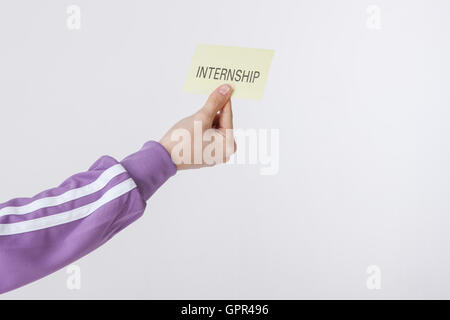 Hand zeigt das Wort des Praktikums Stockfoto