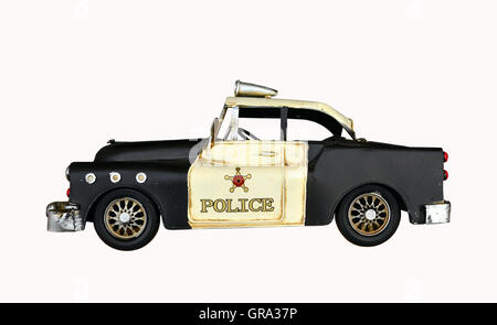 alte Polizei-Auto-Spielzeug auf weißem Hintergrund Stockfoto