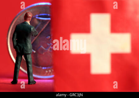 Euro-Münze und Schweizer Flagge Stockfoto