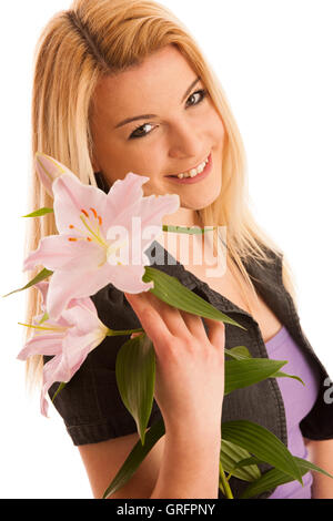 Junge Frau mit Lilie Blume isoliert auf weiß Stockfoto