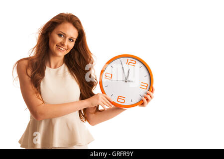 Frau zeigt eine Uhr als Zeichen der spät über weißen isoliert Stockfoto