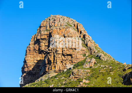 Hout Bay einem Küstenvorort von Cape Town, Südafrika. Dieser Berg ist die Wächter genannt. Stockfoto