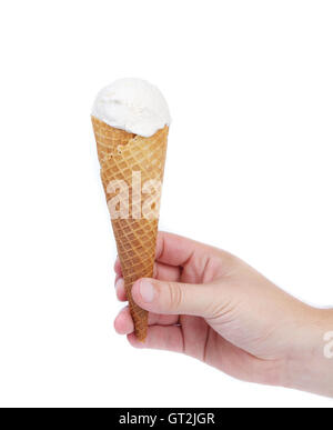 Hand hält Kegel-Vanille-Eis. Stockfoto