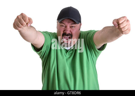 Glücklich Porträt eines bärtigen erwachsenen Mannes in Casual grün Hemd mit Kappe, Screaming Out beim Anheben seine Arme nach seinem Team gewinnt. Stockfoto
