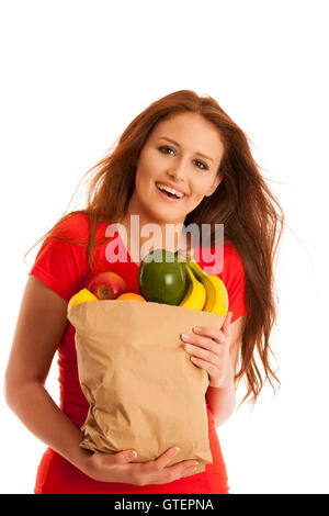 Frau mit einer Tasche voll von verschiedenen Früchten isoliert auf weißem Hintergrund Stockfoto