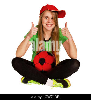 Mädchen sitzen mit Ball auf dem weißen Hintergrund Stockfoto