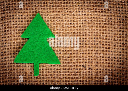 Filz Weihnachtsschmuck auf Jute Hintergrund mit Textfreiraum. Stockfoto