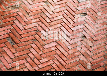 Alte rote Backstein gepflasterten Muster, Hintergrundtextur Foto Stockfoto