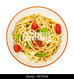Pasta mit Pesto und gerösteten Tomaten Stockfoto