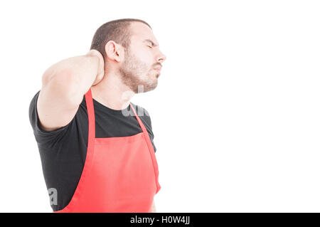 Junge Supermarkt Verkäufer mit Nackenschmerzen als medizinisches Problem Konzept isoliert auf weißem Hintergrund mit Textfreiraum Stockfoto