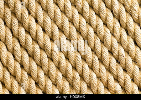 Diagonale Stränge der dicken gelben Seil als Hintergrund mit textfreiraum Textur Themen Stockfoto