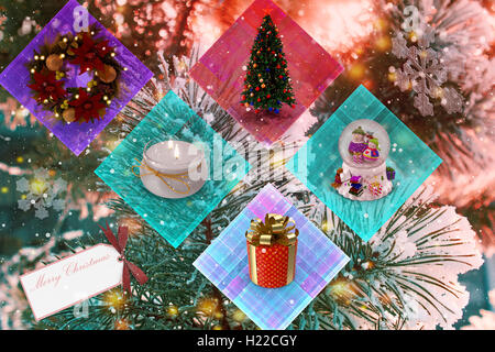 Tannenzweig mit langen Nadeln, mit weißem Schnee bedeckt, auf dem Hintergrund der Bäume. Stockfoto