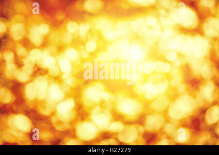 Glänzende Out-of-Focus-highlights in Gold und gelb, eine helle Bokeh Hintergrund ideal für Herbst und Weihnachten Stockfoto