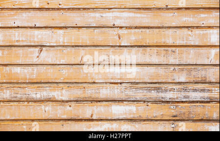 Alten Holzwand mit peeling gelbe Farbschicht, detaillierte Hintergrundtextur Foto Stockfoto