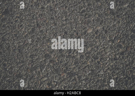 Dunkle grobe Hintergrund mit Felsen und Beton Stockfoto