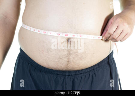 Dicker Mann hält ein Maßband Stockfoto
