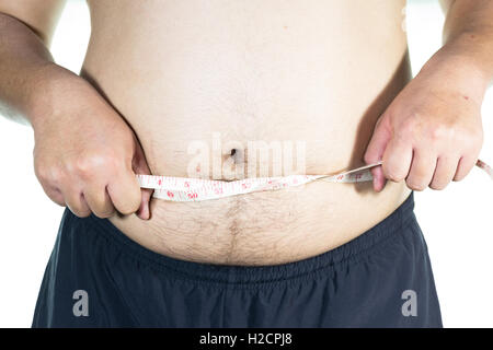 Dicker Mann hält ein Maßband Stockfoto