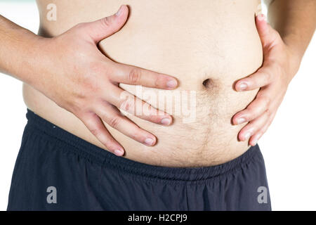 Dicker Mann hält ein Maßband Stockfoto