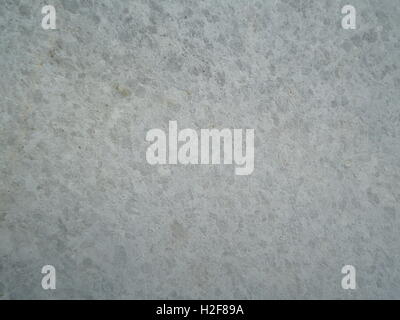 Ein Detail der Zement- und Steinmauer, Textur, Muster, helle Farben, monocrome Stockfoto