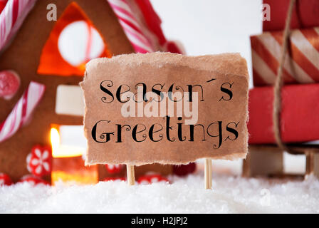 Lebkuchenhaus mit Schlitten, Text Seasons Greetings Stockfoto