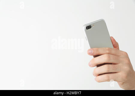 Männliche Hand, die neue Art von smartphone Stockfoto