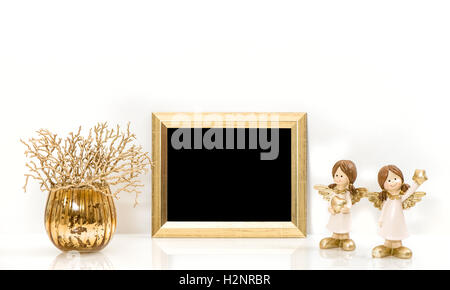 Weihnachtsschmuck Engel und Goldrahmen. Mock-up mit Platz für Ihr Bild oder text Stockfoto