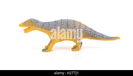 Seite Ansicht orange Kunststoff Dinosaurier Spielzeug auf weißem Hintergrund Stockfoto