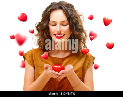 Schönheit junge Frau mit Valentine Herz in ihren Händen Stockfoto