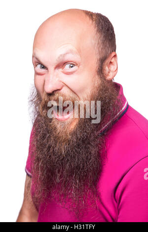 Entfesselt Emotionen. Frustrierte junge Mann mit blauen geöffneten Augen und Mund öffnete stehend Blick in die Kamera, isoliert auf wh Stockfoto