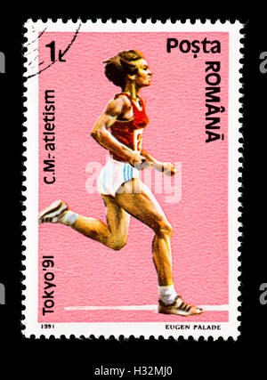 Briefmarke aus Rumänien, die Darstellung eines Läufers, ausgestellt für die 1991 Welt Track &amp; Field Championships in Tokio. Stockfoto